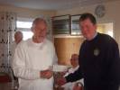 Pres Chas presents the grant from the Rotary Shop towards the cost of a new modern mower.